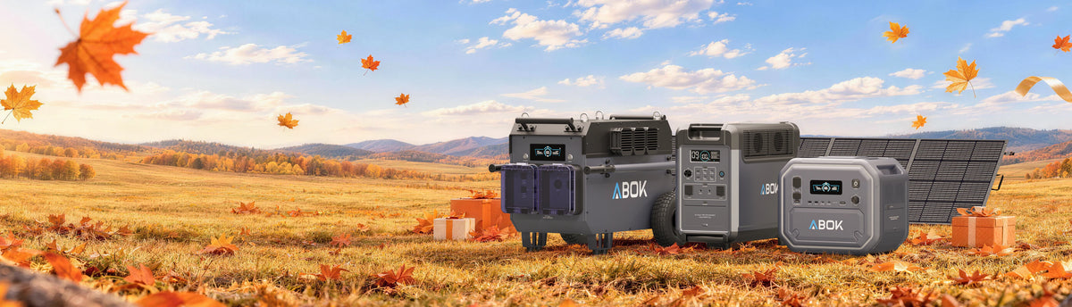 ABOK US fall sale desktop banner showing portable power stations and solar panels with gift boxes in an autumn field.
