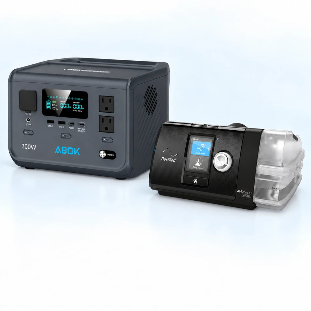 ABOK Ark300 portable power station beside a ResMed AirSense 10 AutoSet CPAP machine on a pale blue and white background.